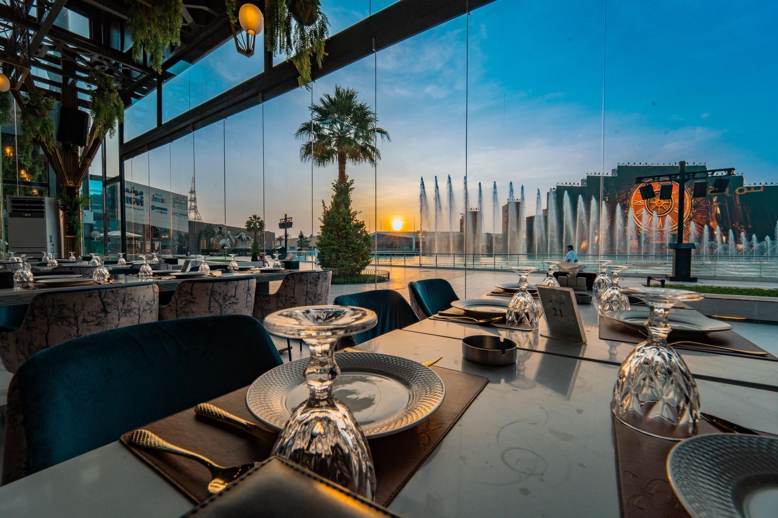 Restaurant terrace overlooking the dancing fountain at sunset