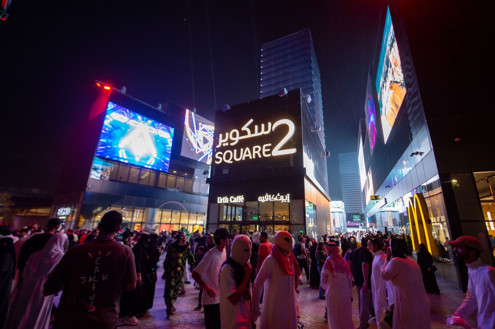 Crowds at Square 2 under the giant screens